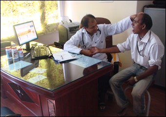 Dr. Vikram Chauhan is clinically diagnosing a patient using pulse and tongue examination techniques described in Ayurveda Dr. Vikram Chauhan is clinically diagnosing a patient using pulse and tongue examination techniques described in Ayurveda